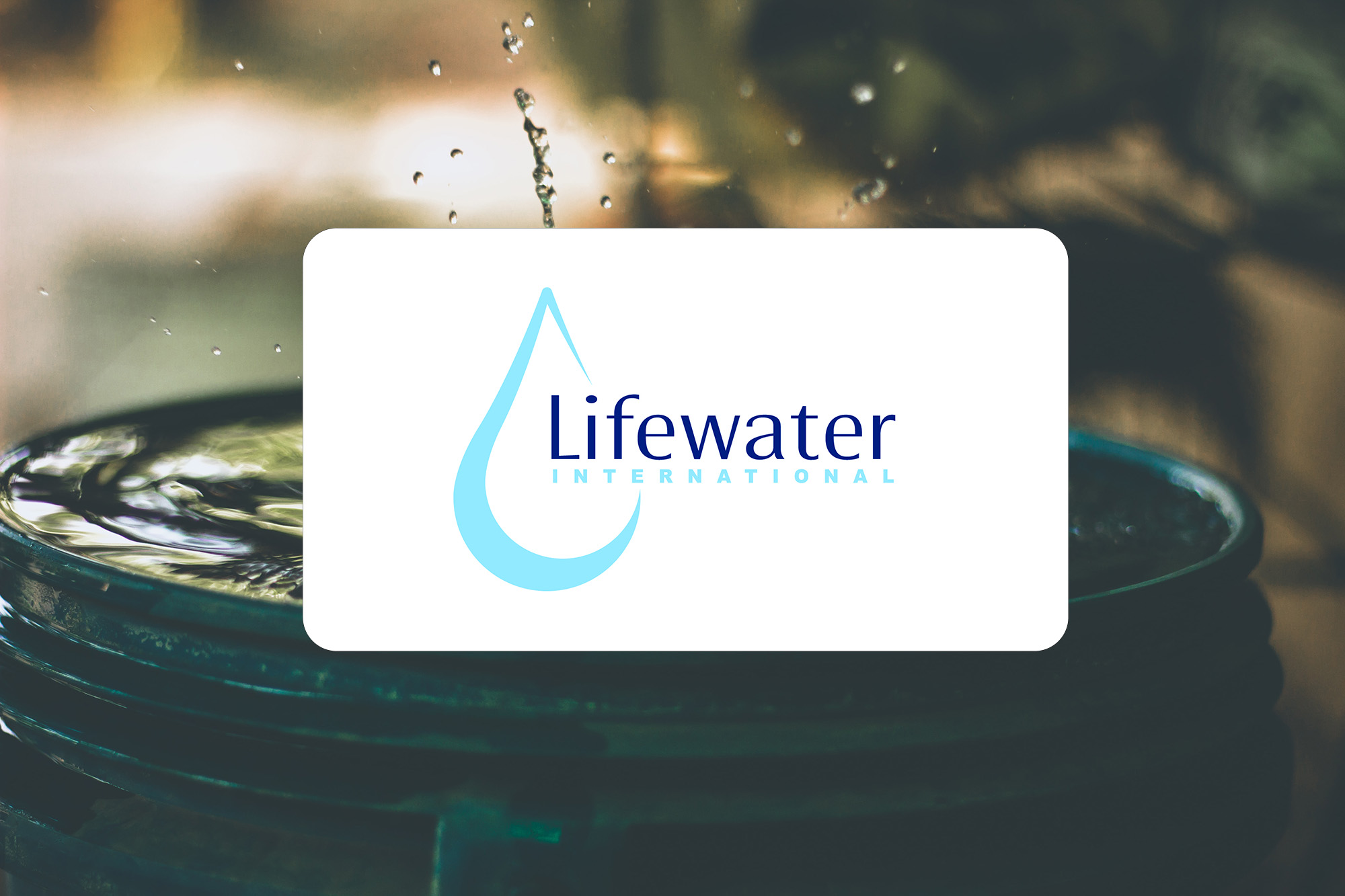 Picture of a barrel of water with the Lifewater International logo on top